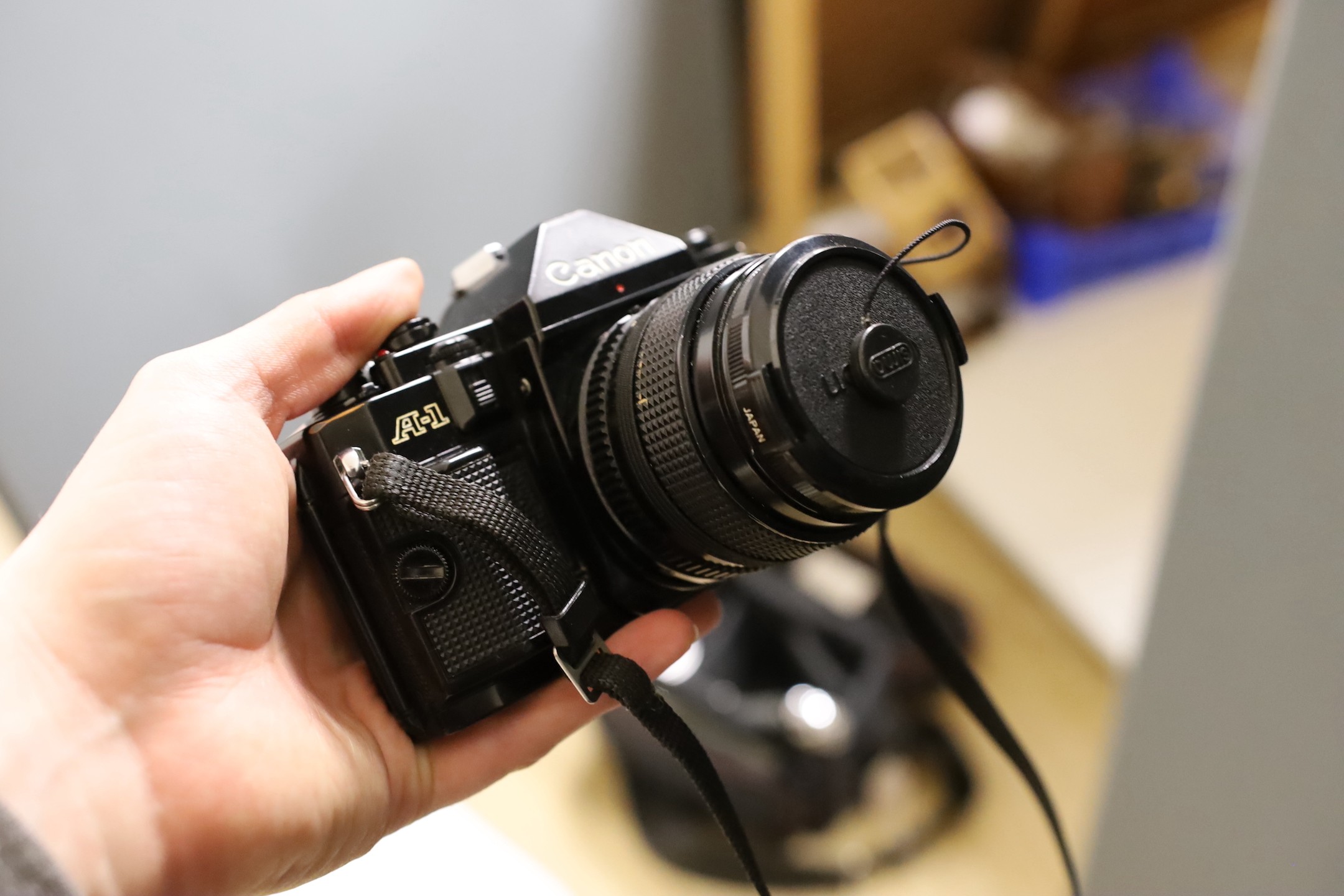 A Canon EF 35mm SLR camera with a 50mm 1:1.4 lens, together with a Susis rapid tripod stand and two other lenses